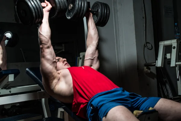 Young bodybuilder doing bench press for chest — Stock Photo, Image