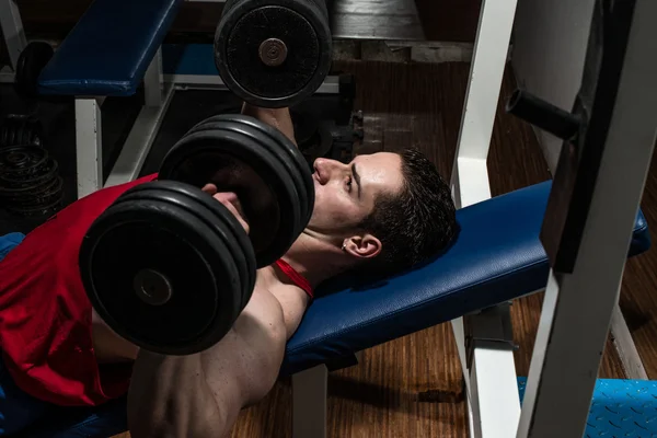 Young bodybuilder doing bench press for chest — Stock Photo, Image