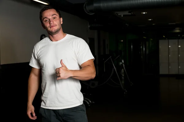 Young Man holding thumbs up — Stock Photo, Image