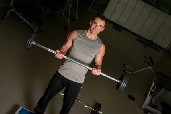 Lifting barbell — Stock Photo, Image