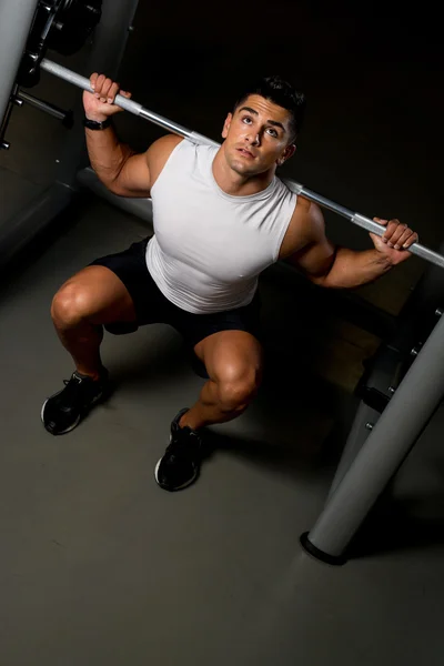 Young man in White T-shirt doing Barbell Squat — Stock Photo, Image