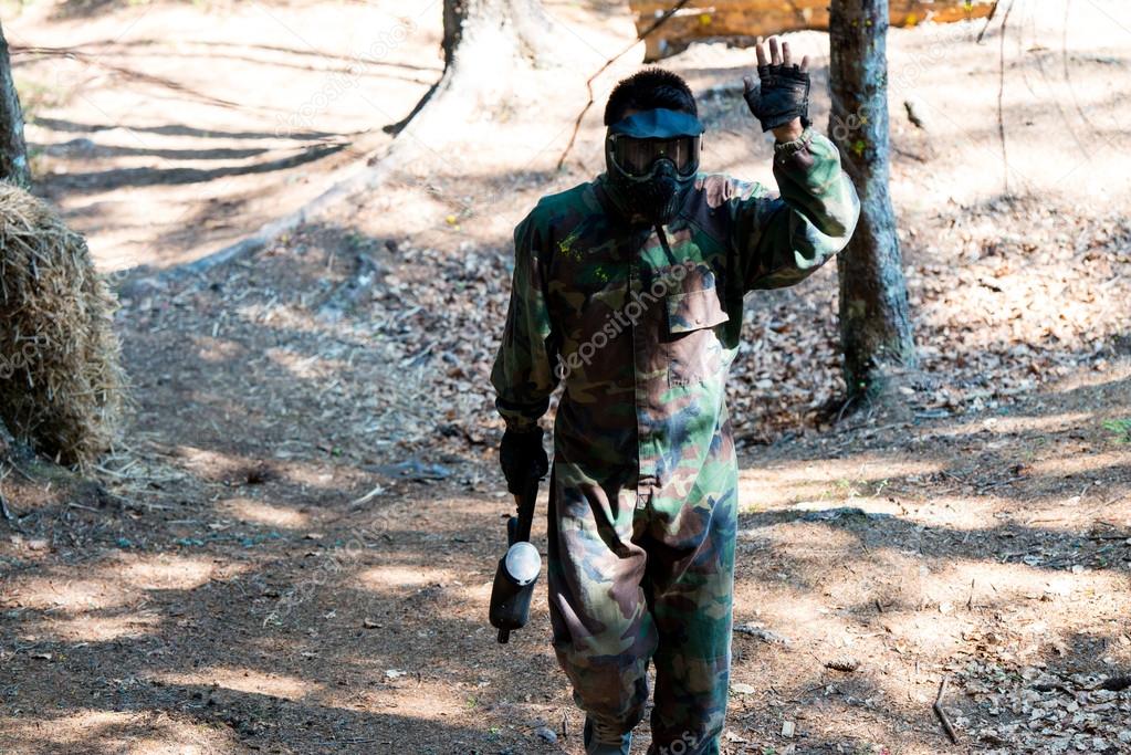 Paintball player resting from playing around