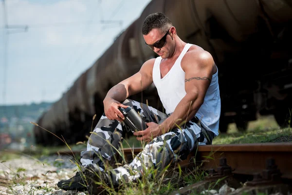 Man Holding Protein Bottle — Stock Photo, Image