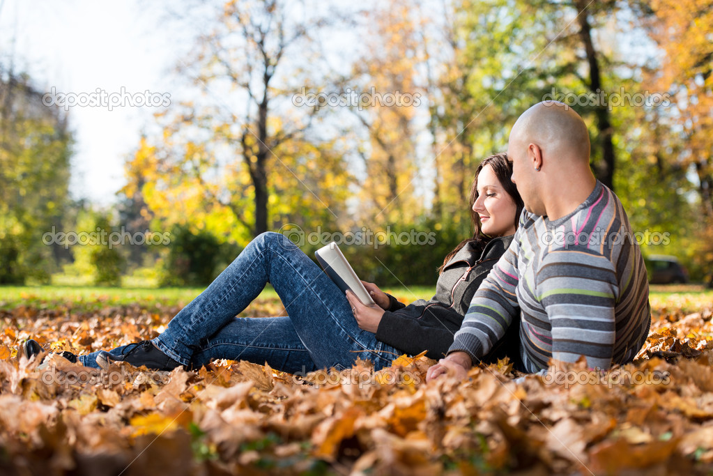 Beautiful Young Couple Using Digital Tablet