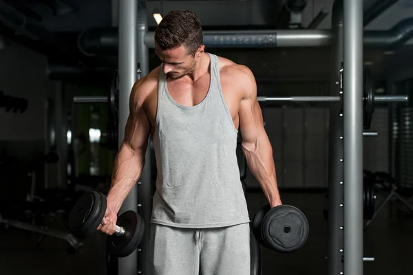 Man Lifting Dumbbell In Gym — Stock Photo, Image