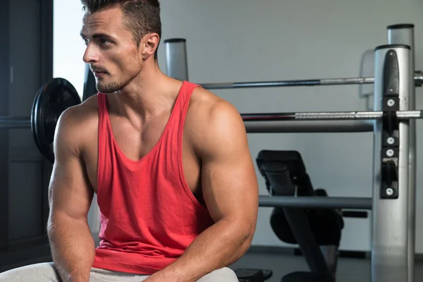 Attractive Young Man Sitting On Bench — Stock Photo, Image