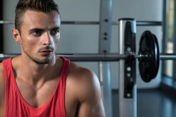 Attractive Young Man Sitting On Bench — Stock Photo, Image