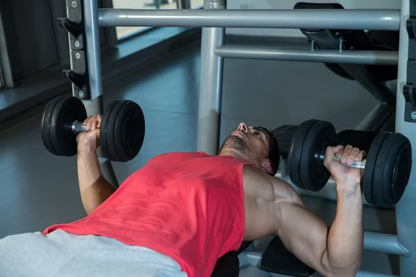 Man Pressing Dumbbells — Stock Photo, Image