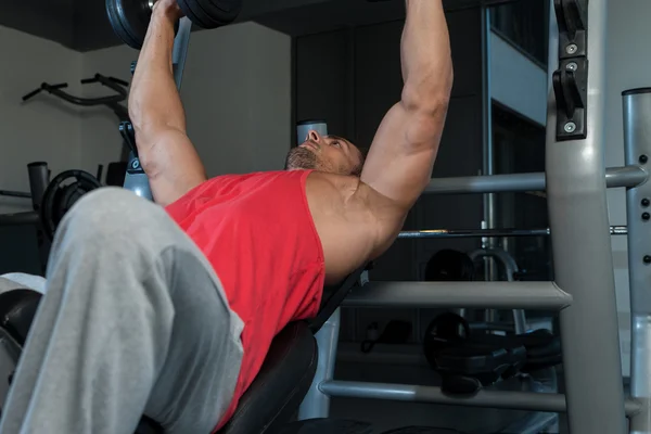 Man Pressing Dumbbells — Stock Photo, Image