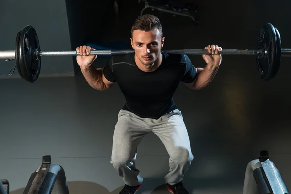 Man Doing Squats — Stock Photo, Image