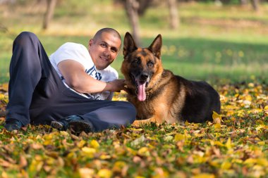 Man Holding Dog German Shepherd