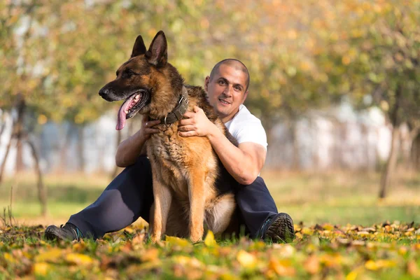 Adult Man Sitting Outdoors With His German Shepherd — Stock Photo, Image