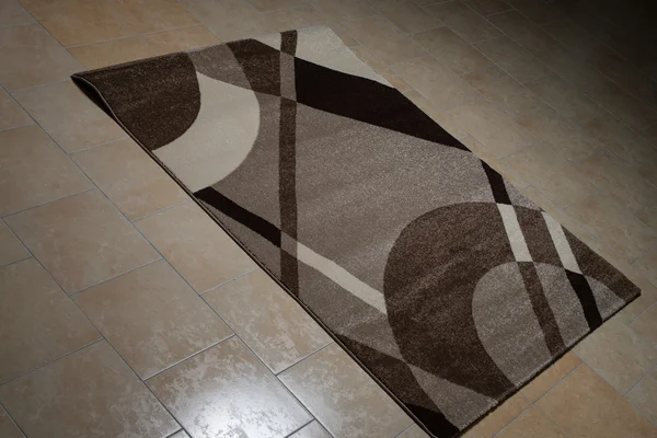 躺在地板上的褐色图案地毯系列 — 图库照片