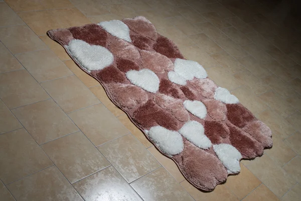 Patroon tapijt op de vloer liggen — Stockfoto