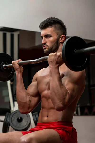 Muscular Man Exercising Biceps — Stock Photo, Image