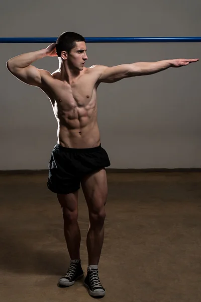 Young Muscular Men Flexing Muscles — Stock Photo, Image