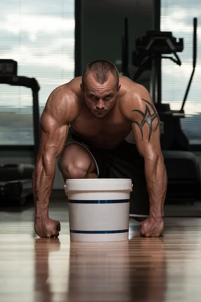 Bodybuilder Posing With Supplements For Copy Space — Stock Photo, Image