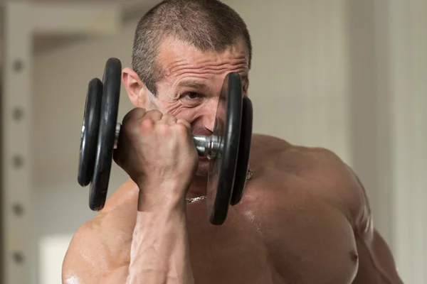 Young Man Doing Exercise For Biceps — Stock Photo, Image