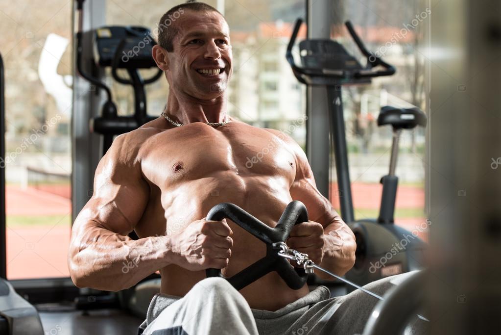Back Exercises On A Seated Row Machine — Stock Photo © ibrak 44892541