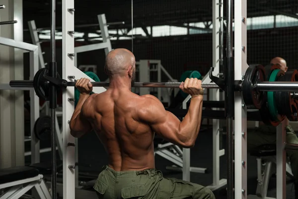 Bodybuilder Doing Heavy Weight Exercise For Shoulder — Stock Photo, Image