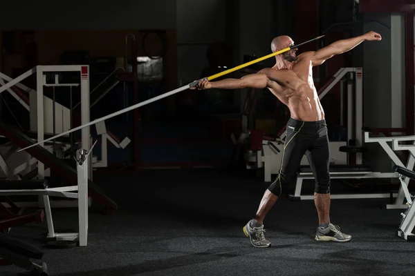Side view Of Muscular Bodybuilder Throwing Javelin — Stock Photo, Image