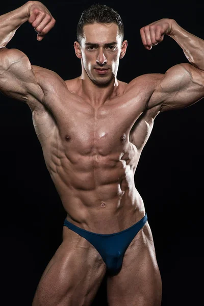 Young Bodybuilder Flexing Muscles Isolate On Black Blackground — Stock Photo, Image