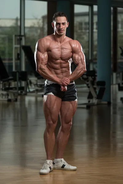 Handsome Body Builder Making Most Muscular Pose — Stock Photo, Image