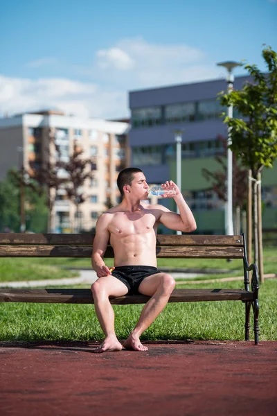 Young Muscular Man Drinking A Water Bottle — Stock Photo, Image