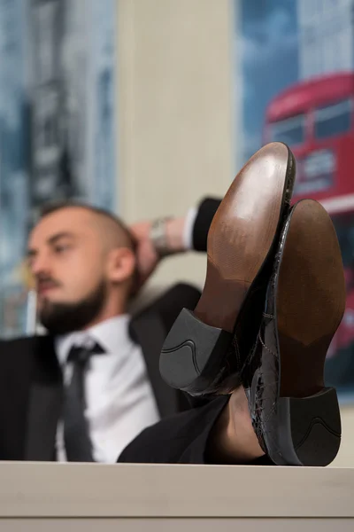 Businessman Puts His Feet Up — Stock Photo, Image