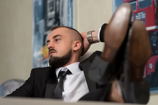 Businessman Puts His Feet Up — Stock Photo, Image