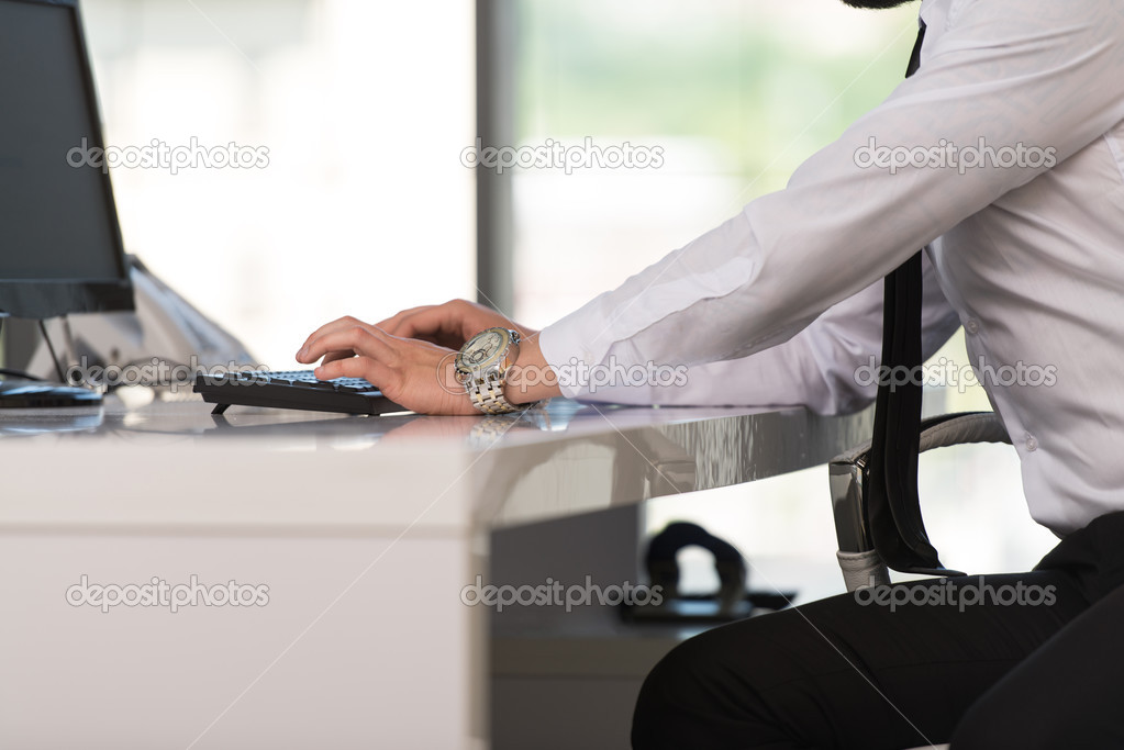 Hands Of A Businessman Using Computer