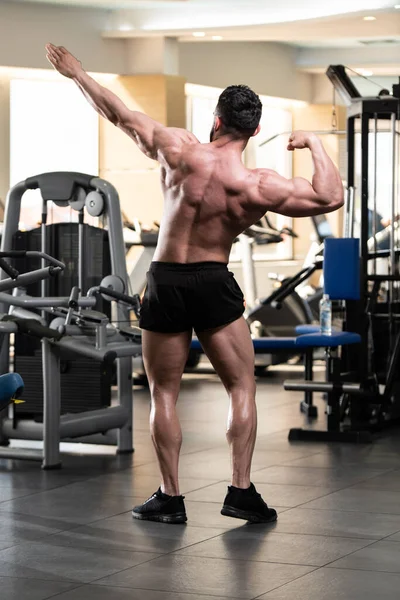 Handsome Young Man Standing Strong Gym Flexing Muscles Muscular Athletic — Stock Photo, Image