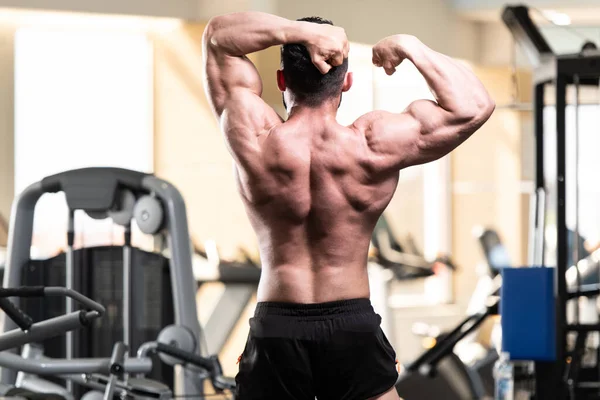 Healthy Young Man Standing Strong Gym Flexing Muscles Muscular Athletic — Stock Photo, Image