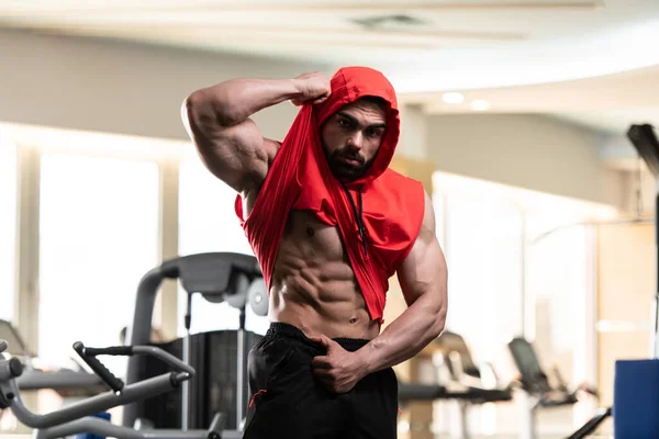 Young Man Standing Strong Gym Flexing Muscles Red Hoodie Muscular — Photo