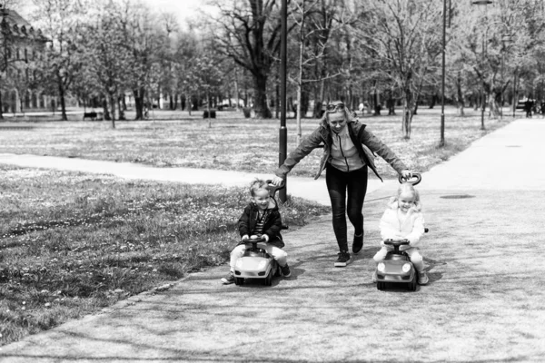 Mom Kids Playing Toy Car Outdoors Park Happy Boy Girl — стоковое фото