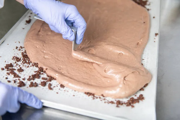 Pastry Chef Making Crust Cake From Chocolate and Cream