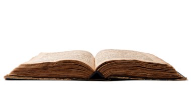 Single old worn jewish book. Open pages of Torah isolated on white background. Closeup. Selective focus