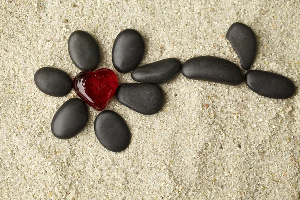 Flower with black stones — Stock Photo, Image