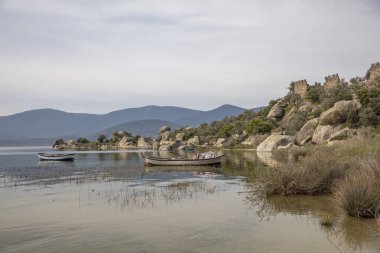 Lake Bafa is a lake and a nature reserve situated in southwestern. At the innermost north-east tip of the lake is the village of Kapikiri, as well as the ruins of Heraclea by Latmus.