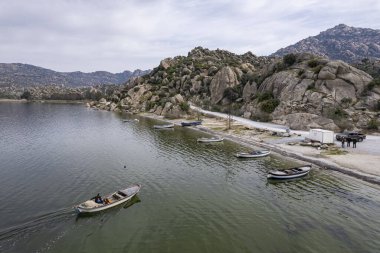 Lake Bafa is a lake and a nature reserve situated in southwestern. At the innermost north-east tip of the lake is the village of Kapikiri, as well as the ruins of Heraclea by Latmus.
