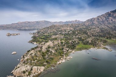 Lake Bafa is a lake and a nature reserve situated in southwestern. At the innermost north-east tip of the lake is the village of Kapikiri, as well as the ruins of Heraclea by Latmus.