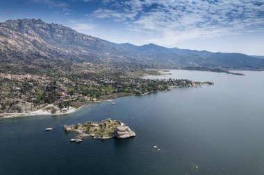 Lake Bafa is a lake and a nature reserve situated in southwestern. At the innermost north-east tip of the lake is the village of Kapikiri, as well as the ruins of Heraclea by Latmus.