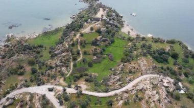 Lake Bafa is a lake and a nature reserve situated in southwestern. At the innermost north-east tip of the lake is the village of Kapikiri, as well as the ruins of Heraclea by Latmus.