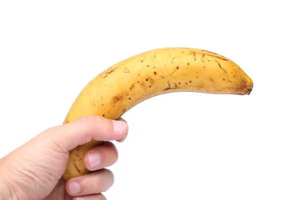 Eine abgestandene Banane in der Hand — Stockfoto