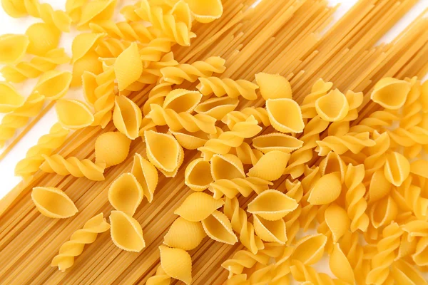 En bakgrund av olika pasta — Stockfoto
