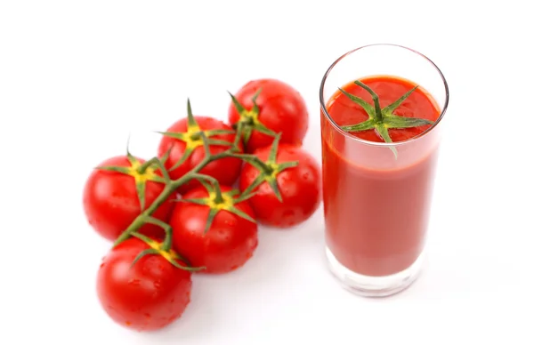 Isoliertes Bild ein Glas Saft und Tomaten — Stockfoto