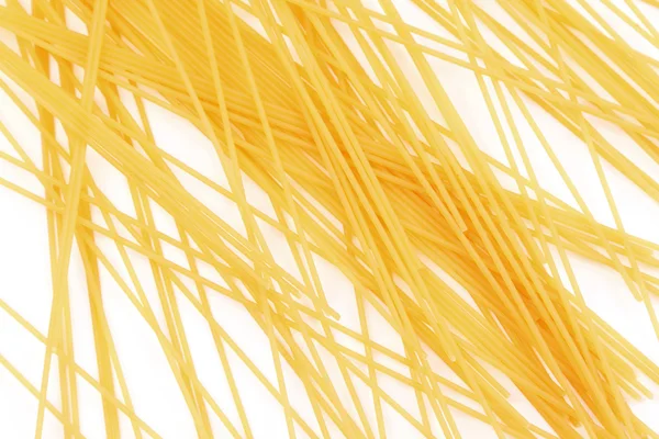 Uncooked italiano spaghetti maglia fondo — Foto Stock