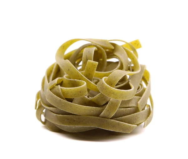 Nest of green tagliatelle isolated on white — Stock Photo, Image