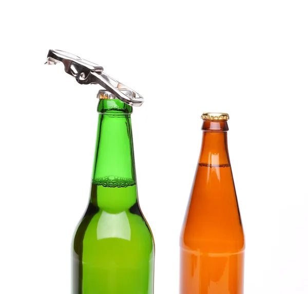 Two bottles of beer and a opener — Stock Photo, Image