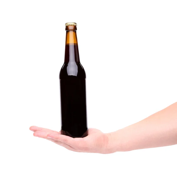 Бутылка пива на руке — стоковое фото